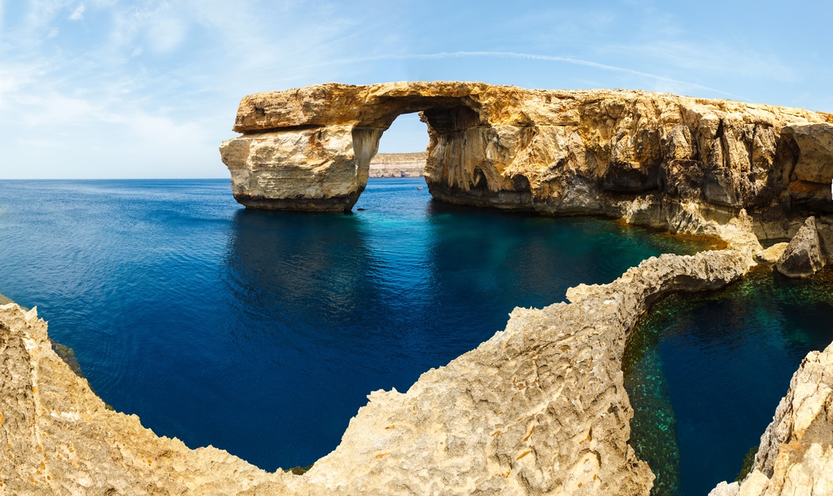 Living in Malta for teachers include beautiful waterfront views with underwater cave systems
