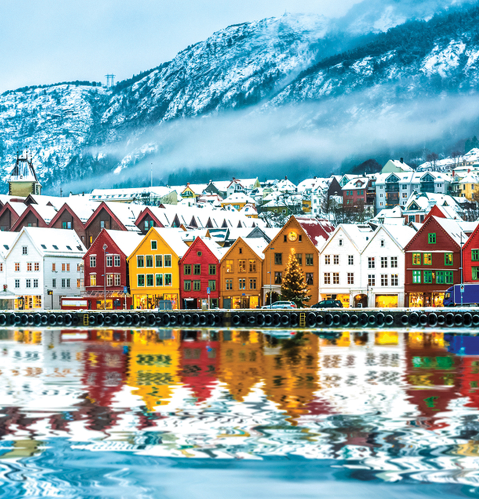 teaching in norway includes winter mountainscape views and sights of colorful row houses