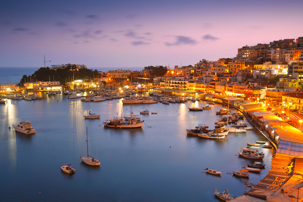 greece's coastal waterfront at night